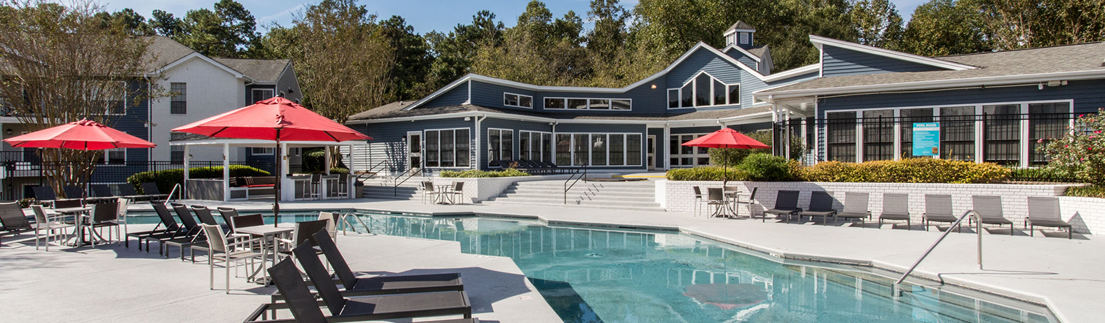 Resort style pool surrounded by lounge chairs